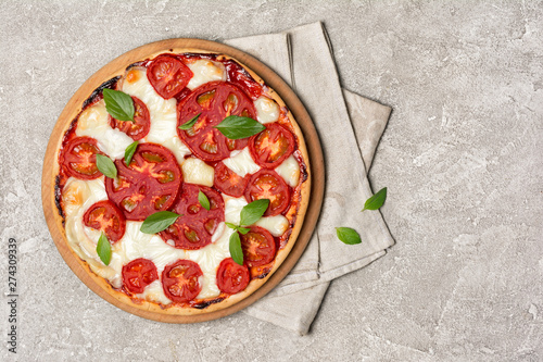 Pizza margarita with tomato, mozzarella cheese and basil