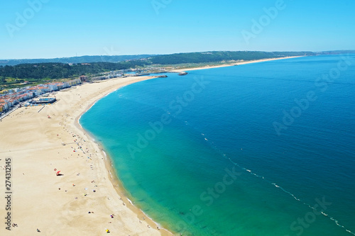 Panoramic top view of famous Nazare beach, Atlantic ocean Algarve, Portugal. Copy space for text, background.