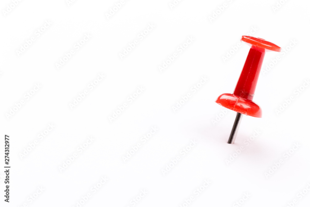 Single red pin isolated on a white background