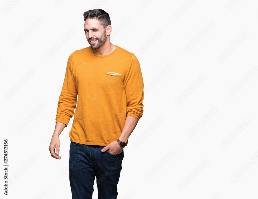 Young handsome man over isolated background winking looking at the camera with sexy expression, cheerful and happy face. Young handsome man over isolated background winking looking at the camera with sexy expression, cheerful and happy face.