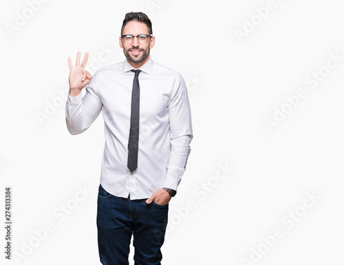 Young handsome business man wearing glasses over isolated background showing and pointing up with fingers number three while smiling confident and happy.