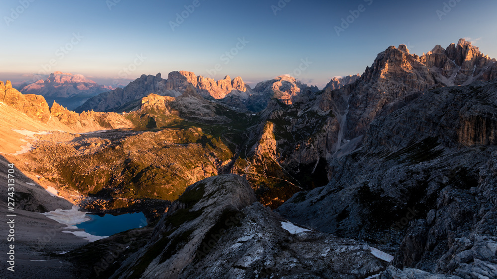Panorama of dolomites near Tre cime di lavadero as seen from büllelejoch at golden hour