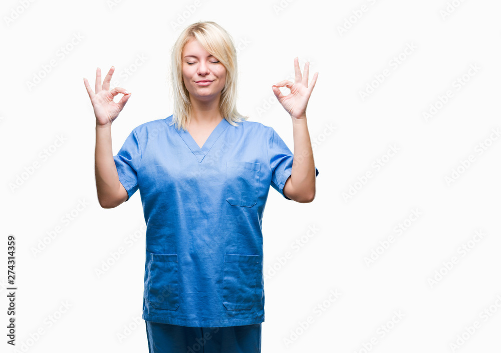 Young beautiful blonde nurse doctor woman over isolated background relax and smiling with eyes closed doing meditation gesture with fingers. Yoga concept. Young beautiful blonde nurse doctor woman over isolated background relax and smiling with eyes closed doing meditation gesture with fingers. Yoga concept.