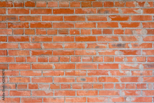 Brickwork in the construction of a new high-rise building. The use of traditional building materials.