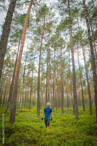 wandering cyclist in nature without bicycle