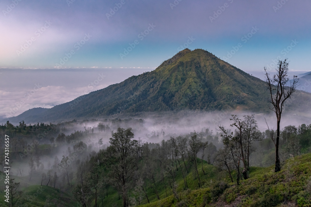 A misty blue sunrise from Ijen volcano A misty blue sunrise from Ijen volcano