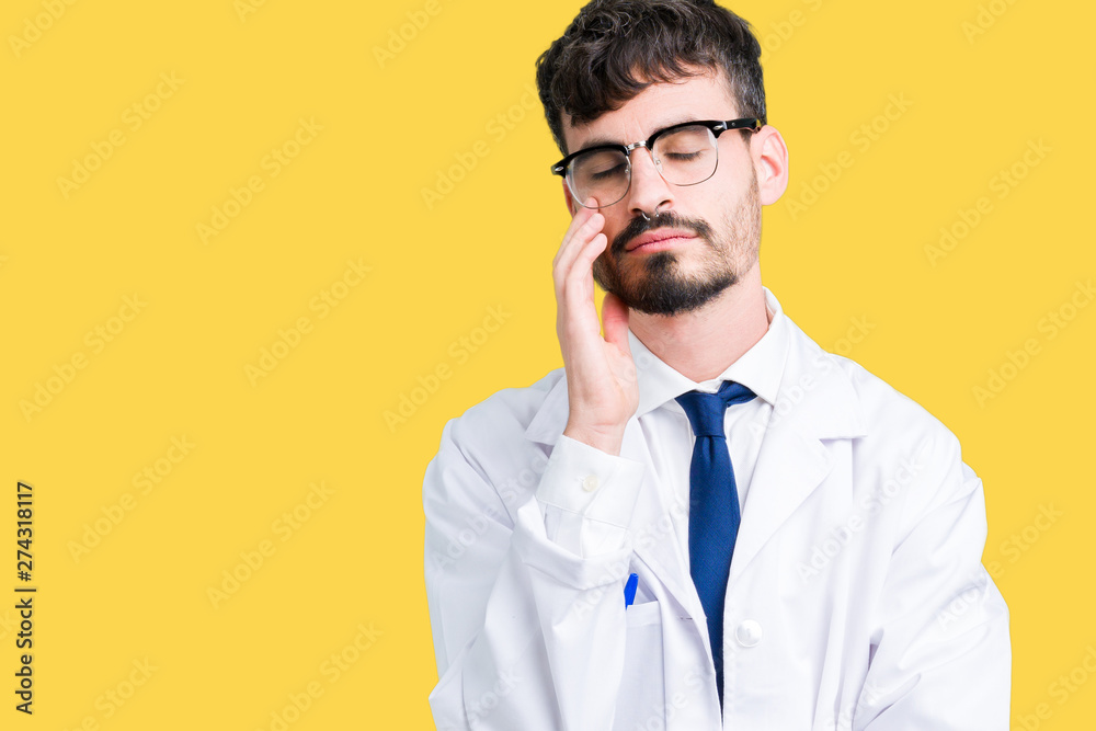 Young professional scientist man wearing white coat over isolated background thinking looking tired and bored with depression problems with crossed arms. Young professional scientist man wearing white coat over isolated background thinking looking tired and bored with depression problems with crossed arms.
