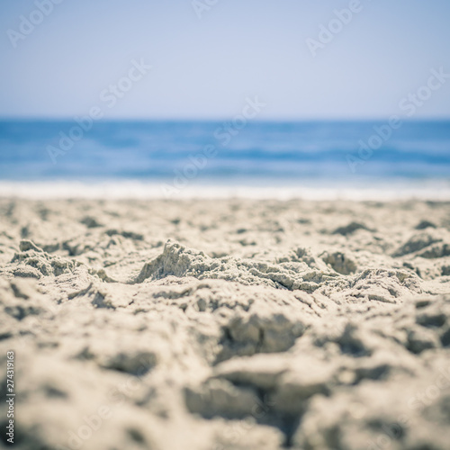 Sand in Focus in Foreground  Ocean Blurred Beyond