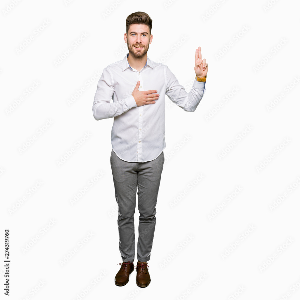 Young handsome business man Swearing with hand on chest and fingers, making a loyalty promise oath Young handsome business man Swearing with hand on chest and fingers, making a loyalty promise oath