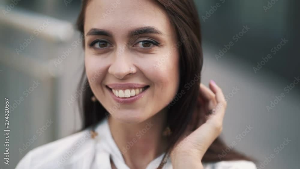Portrait of beautiful smiling girl with natural make up, slow motion Portrait of beautiful smiling girl with natural make up, slow motion