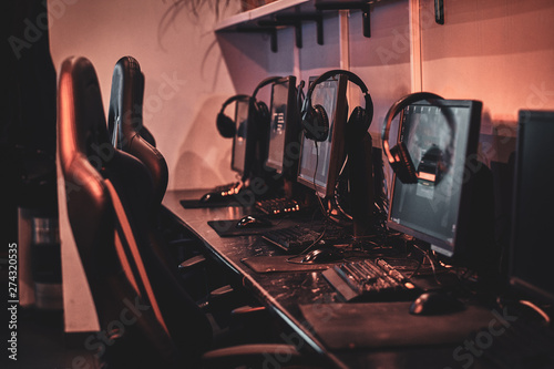 Empty comfortable studio for professional gamers with computers and earphones. photo