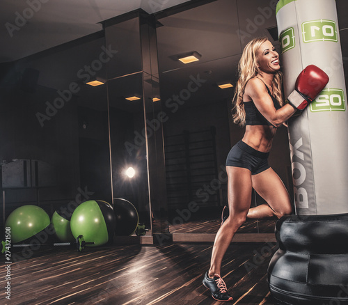 Sexy female boxer posing in...