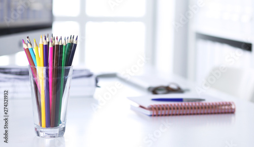 Stylish workspace with desktop computer, office supplies, houseplant and books at office. desk work concept.