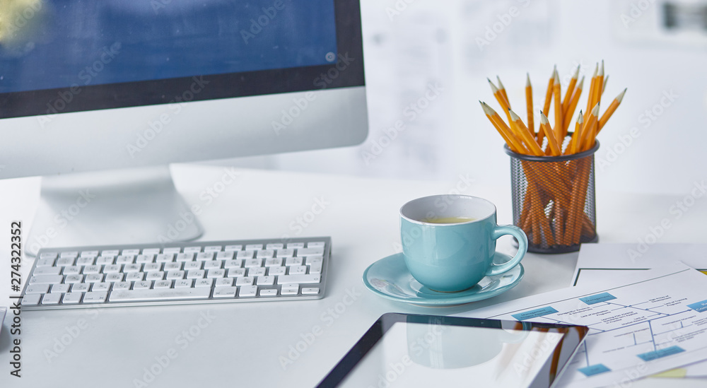 A cup of coffee on the office table A cup of coffee on the office table