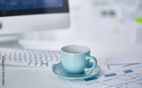 A cup of coffee on the office table