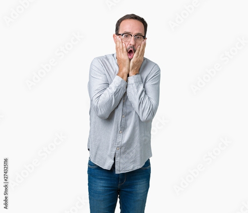 Handsome middle age elegant senior man wearing glasses over isolated background Tired hands covering face, depression and sadness, upset and irritated for problem