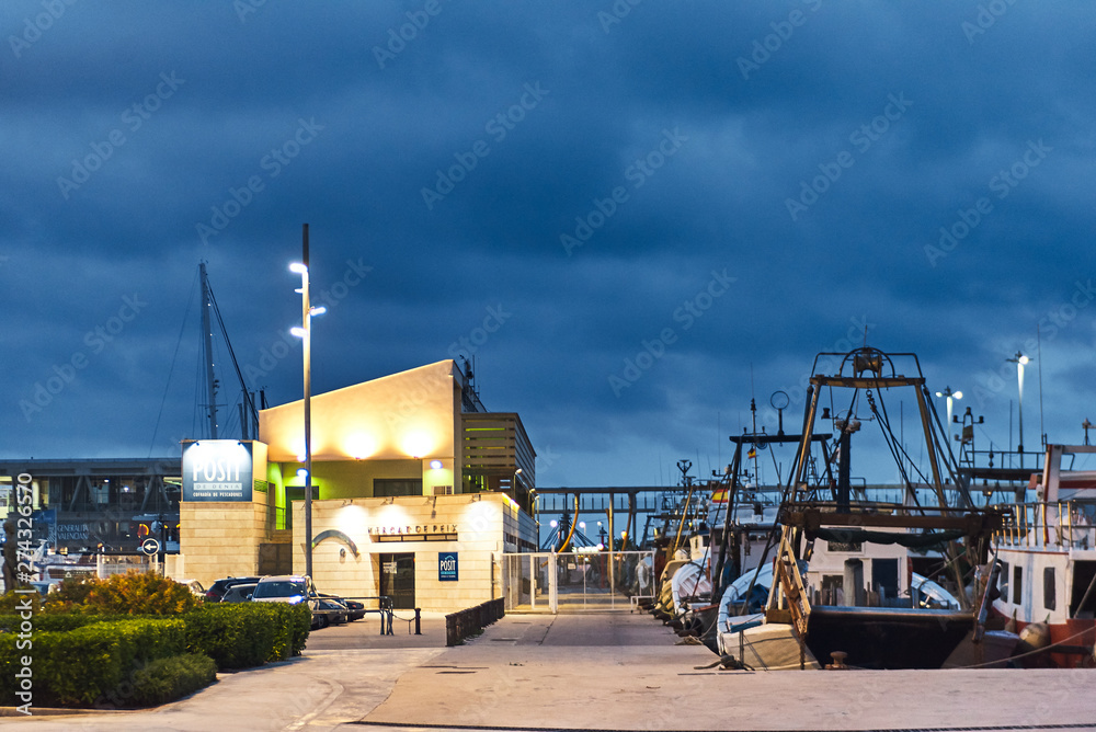 DENIA, SPAIN - JUNE 13, 2019: Fishing boat with ropes in the port of Denia town.