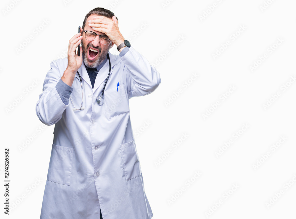 Middle age senior hoary doctor man talking on smartphone over isolated background stressed with hand on head, shocked with shame and surprise face, angry and frustrated. Fear and upset for mistake. Middle age senior hoary doctor man talking on smartphone over isolated background stressed with hand on head, shocked with shame and surprise face, angry and frustrated. Fear and upset for mistake.