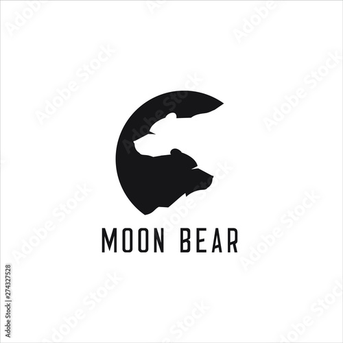 negative space that forms two bears with the moon background