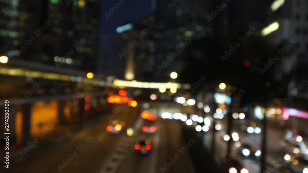 night city lights and traffic lights in Asia, defocused. Colorful blurred bokeh of moving transport and city lights in busy business district. night city lights and traffic lights in Asia, defocused. Colorful blurred bokeh of moving transport and city lights in busy business district.