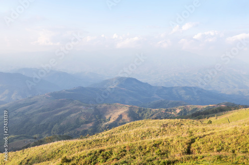 Landscape view grass in meadow on slope of the mountain at doi chang mup near Thailand & Myanmar border Mae Sai, Chiang Rai, Thailand 