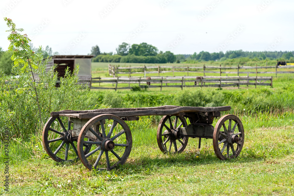 old wooden cart wagon green grass landscape