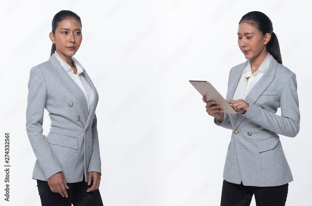 Portrait half body Snap Figure, Asian Business Woman Stand in Gray Formal proper Suit black pants and shoes, studio lighting white background isolated, Lawyer Boss touch tablet success work smile glad Portrait half body Snap Figure, Asian Business Woman Stand in Gray Formal proper Suit black pants and shoes, studio lighting white background isolated, Lawyer Boss touch tablet success work smile glad