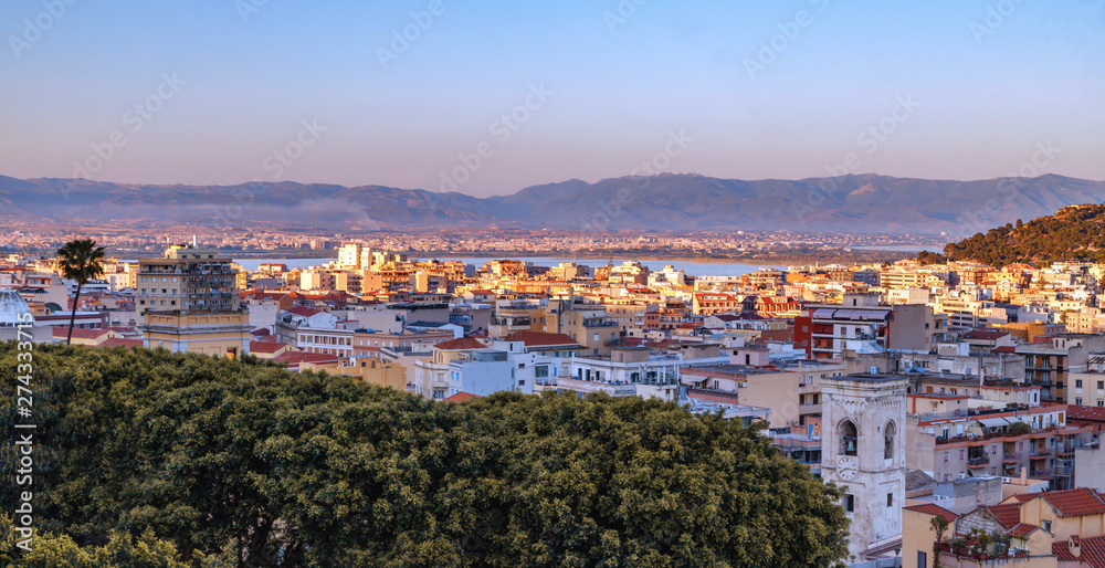Cagliary, capital of Sardinia (Sardegna), Italy. Aerial panoramic view of the city. Cityscape at golden hours.