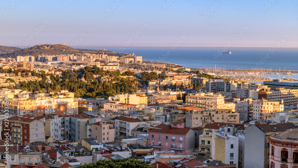 Cagliary, capital of Sardinia (Sardegna), Italy. Aerial panoramic view of the city. Cityscape at golden hours.