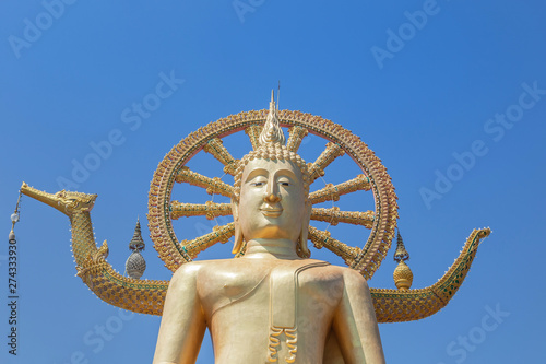 Public big Buddha temple in Wat Phra Yai sitting under blue sky most popular famous landmark tourist destination Koh Samui Surat Thani province, Thailand