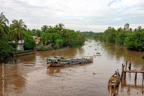 28 DECEMBER 2016, Vietnam, Tan Tru.Boat on the mekong river in south vietnam near vinh long on a sunny summer day.