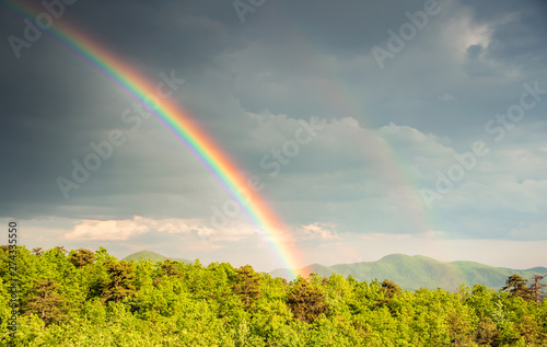 Stunning spring rainbow view of the south mountains from Black Mountain, NC, USA.