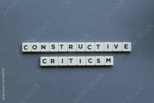 фотографія ' Constructive Criticism ' word made of square letter word on grey background