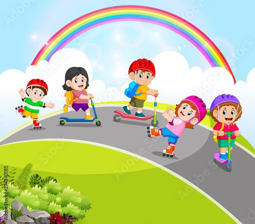 the children are playing with the scooter and roller skates in the road