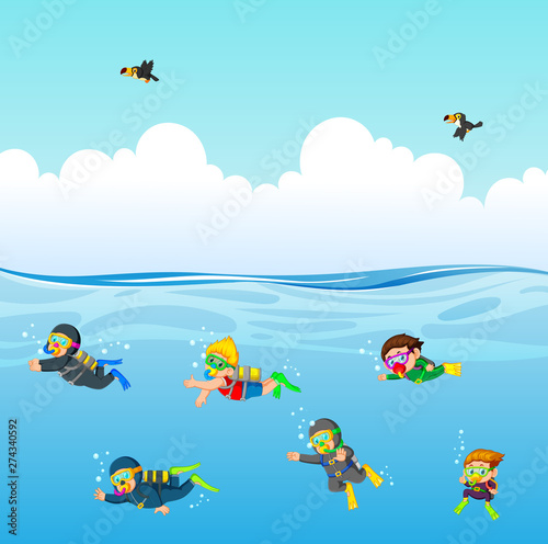 the professional diver are diving under the blue ocean  © hermandesign2015