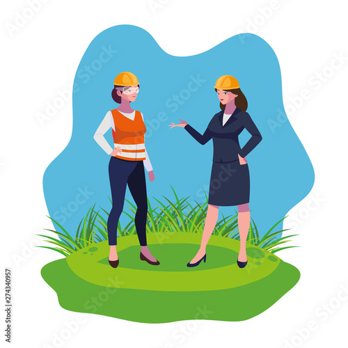 female builder and engineer woman on the lawn