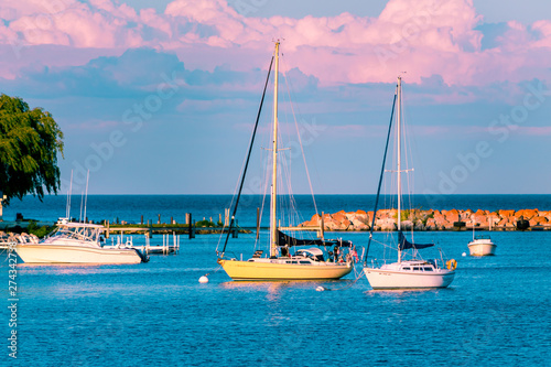 Sail boats docked at the marina at Mackinac Island during sunset