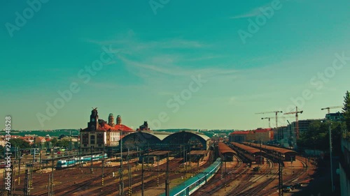 time lapse of Prague main train station, Hlavni Nadrazi on blue sky sunny summer day photo