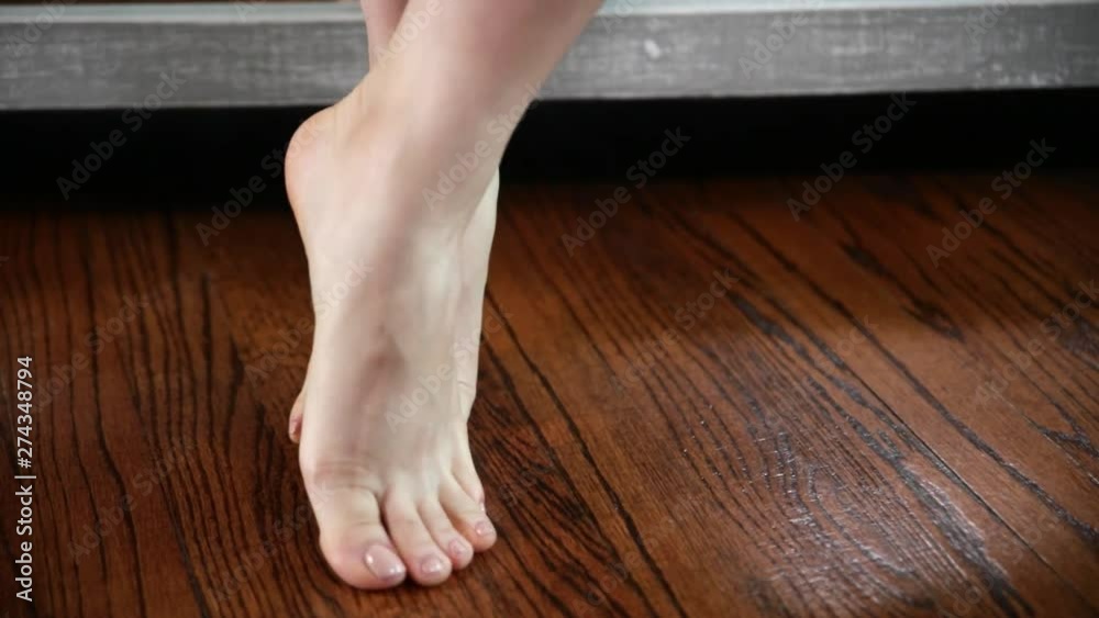 Woman shows and touches her feet, legs and ankles Woman shows and touches her feet, legs and ankles