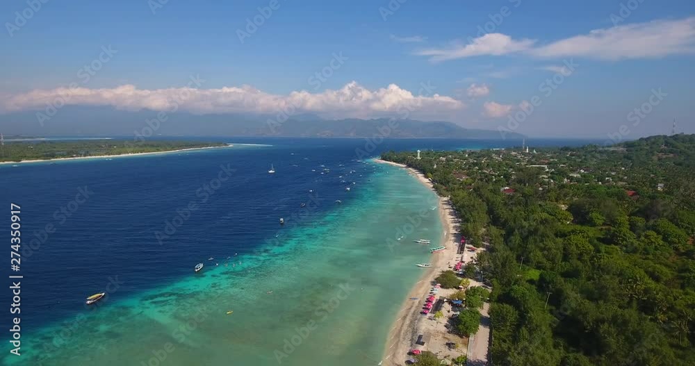 x2 speed aerial view drone flying over gili trawangan towards gili meno, Bali, Indonesia, holiday footage of tropical islands and beach. x2 speed aerial view drone flying over gili trawangan towards gili meno, Bali, Indonesia, holiday footage of tropical islands and beach.