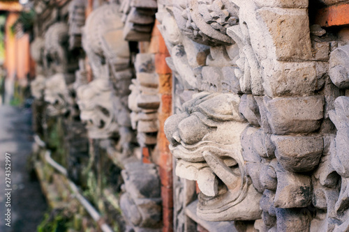 Mystical creatures on the wall of temple in Bali.