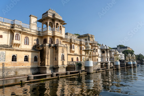 Architecture, decorated facade near water lake in Udaipur, Rajasthan, India
