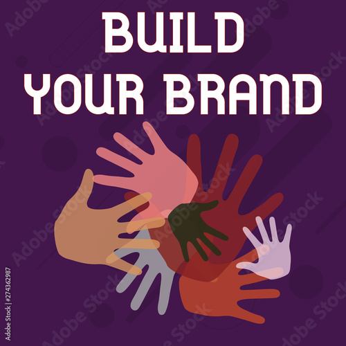 Writing note showing Build Your Brand. Business concept for enhancing brand equity using advertising campaigns Hand Marks of Different Sizes for Teamwork and Creativity