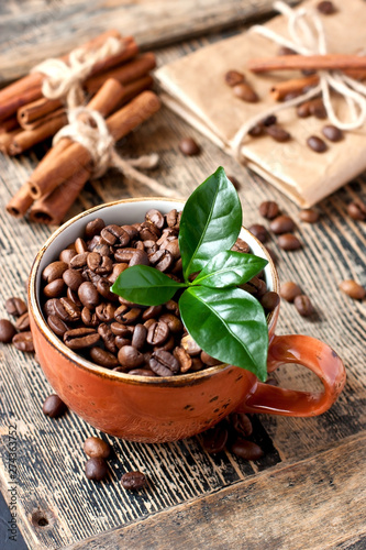 Wallpaper Mural Cup full of coffee beans on wooden tableC Torontodigital.ca