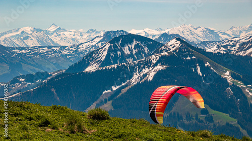 Beautiful alpine view with a paraglider at Hohe Salve summit - Söll - Tyrol - Austria