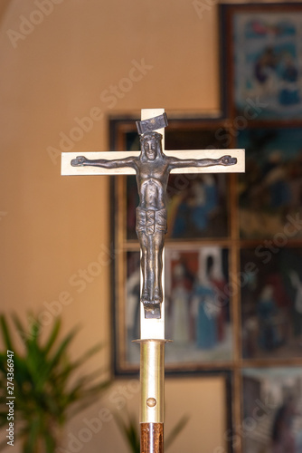 cross with Jesus Christ with blurry background