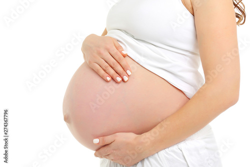 Pregnant woman's belly close-up, big belly button
