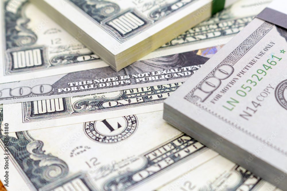 Pack of dollars banknotes and coins background finance economy currency close up selective focus US currency USD Pack of dollars banknotes and coins background finance economy currency close up selective focus US currency USD