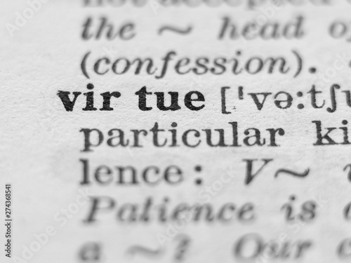 Dictionary definition of word virtue, selective focus.