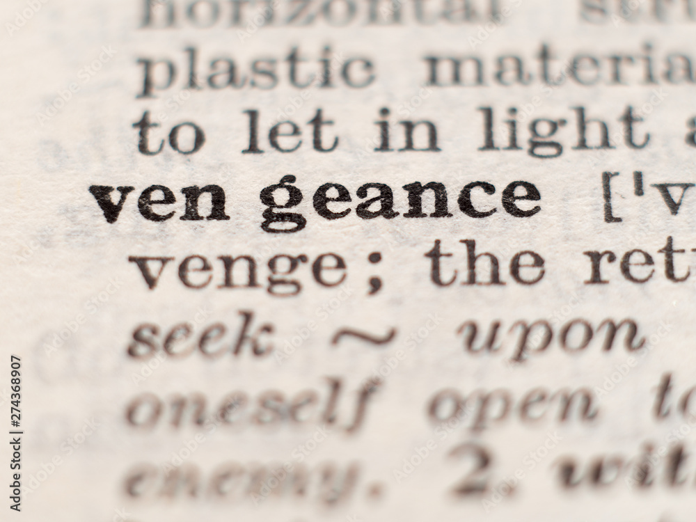 Dictionary definition of word vengeance, selective focus. Stock